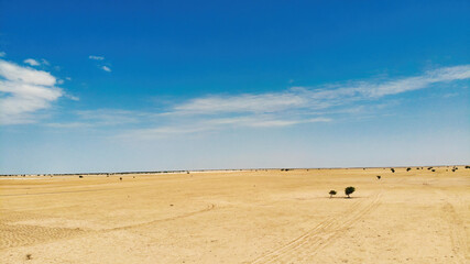 Obraz premium Aerial photograph of the vehicle driving in the African Sahara desert