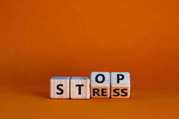 Stop stress and be health symbol. Turned wooden cubes and changed words 'stress' to 'stop'. Beautiful orange background. Psychological, business and stop stress concept. Copy space. - obrazy, fototapety, plakaty