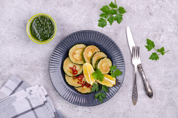 Fried zucchini with green sauce