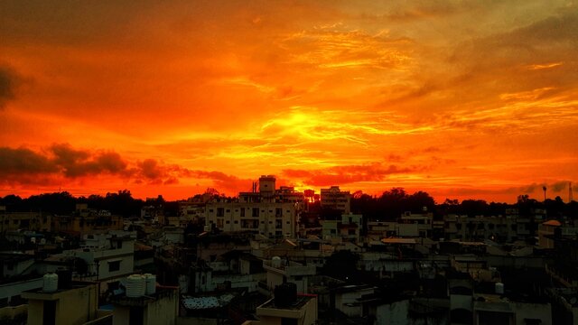 sunset in the city with buildings