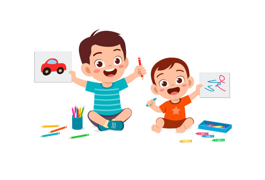 cute little boy drawing together with baby sibling