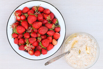 Fresh ripe delicious strawberries and oatmeal