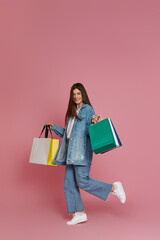 beautiful woman holding shopping bags with purchases