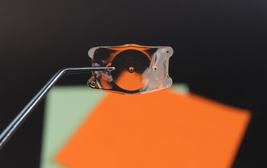 closeup photo of the implantable collamer lens ICL for treating refractive errors - obrazy, fototapety, plakaty