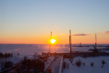 Fototapeta na wymiar Skyline with sunset, construction and Russian winter