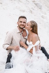 Beautiful wedding couple bride and groom at wedding day outdoors at ocean beach. Happy marriage couple o