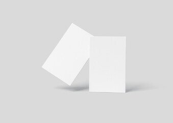 3D rendering of two pieces of rectangular paper on a gray background with shadows below them