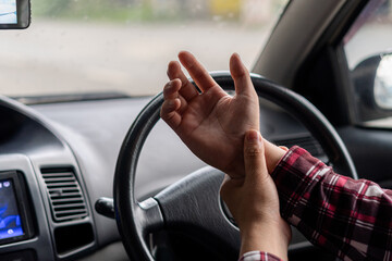 Young man has hand pain that he drives long distances.