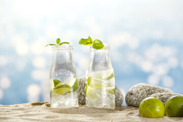 Fresh water in bottle and sea landscape 