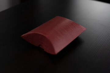 Small red packaging for small objects