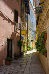 Fototapeta na wymiar A quiet back street in the historic medieval coastal town of Porec in Istria, Croatia 