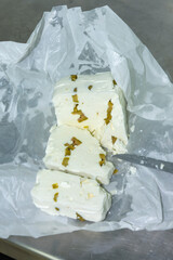 phases of Greek feta cheese production in a cheese factory in Greece