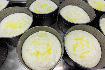 phases of Greek feta cheese production in a cheese factory in Greece