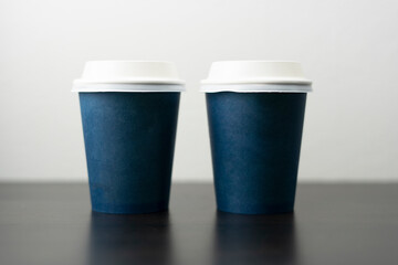 Two blue blank cafe cups