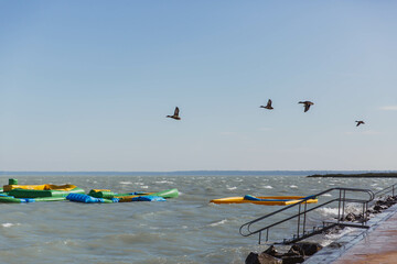 Trampolines for active recreation on the water on Lake Balaton in windy weather, Hungary.