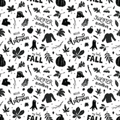 Seamless hand-drawn black and white autumn pattern with lettering, pumpkins, fallen leaves, branches and seeds. Many details. For prints, backgrounds, wrapping paper, textile, linen, wallpaper, etc. 