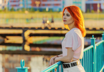 Beautiful young woman on embankment