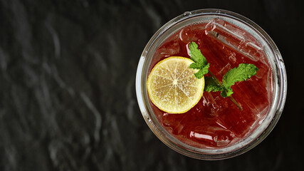 Mocktail - Strawberry Soda with Slice Lemon and Mint Leaf.