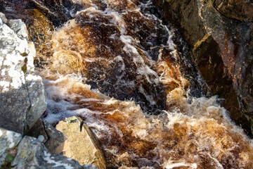 Peaty water streaming down in County Donegal - Ireland