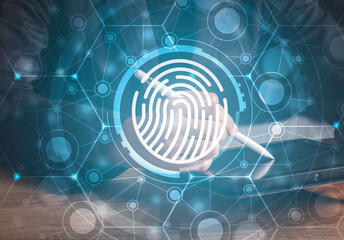 Fingerprint scan provides security human password access with biometrics identification. Cyber security Concept with Businessman using tablet background .