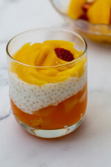 Sweet tapioca pudding with fresh mango and strawberry