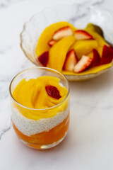 Sweet tapioca pudding with fresh mango and strawberry