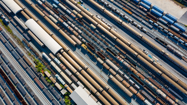 Aerial top view of train container cargo on the railway station for transportation background. wagons with goods on railroad.