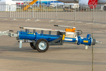 Aircraft tow truck for connected to the tug of the nose landing gear, close up.
