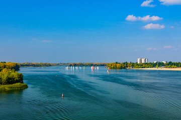 Many yachts at the river Dnieper on autumn in Kremenchug, Ukraine. Sailing regatta
