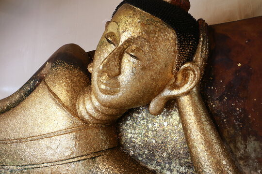 Buddha statue lying on the left side at Wat pa phadoo Tample, Rayong.Thailand, close up face monk.