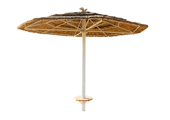 Large beach umbrella made of straw isolated on white background. Sun protection in a resort by the...