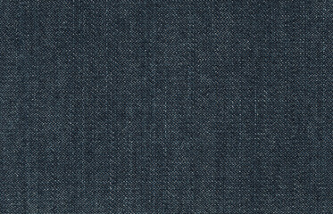 Jeans fabric texture. Dark blue jeans surface. Denim fabric background.