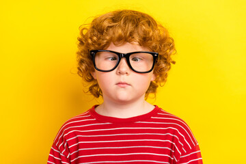 Photo of young fooling small little boy wear glasses red striped sweater isolated on bright yellow color background