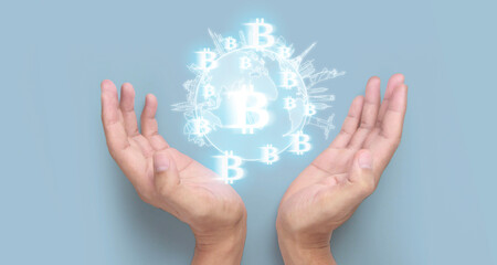 Hands showing bitcoin icon as virtual money digital