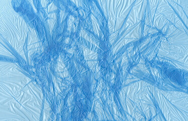 Plastic bag texture. Blue garbage polyethylene bag surface. Used plastic bags waste. Plastic pollution problem background.