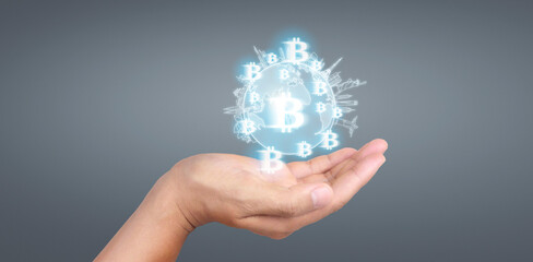 Hands showing bitcoin icon as virtual money digital