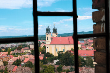 View of a church through the window in Tata, Hungary