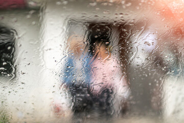 raindrops on transparent glass on a beautiful background