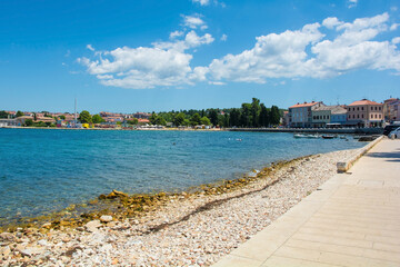 The summer coast just north of the historic centre of Porec on the Istria coast of Croatia