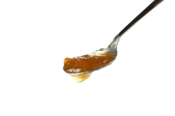 Fototapeta na wymiar Spoon with peach jam isolated on white