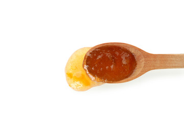 Spoon with peach jam isolated on white