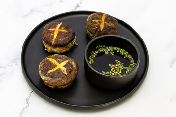 Korean food Pyogobeoseot-Jeon which is fried Shiitake mushroom with meatball