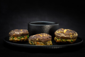 Korean food Pyogobeoseot-Jeon which is fried Shiitake mushroom with meatball