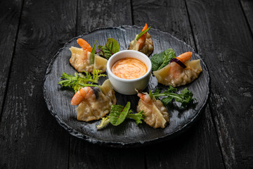 Japanese dumplings on a dark table in a japanese restaurant