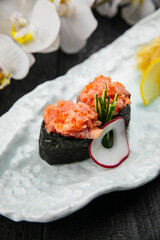 Japanese rolls on a white plate. Japanese cuisine
