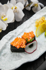 Japanese rolls on a white plate. Japanese cuisine
