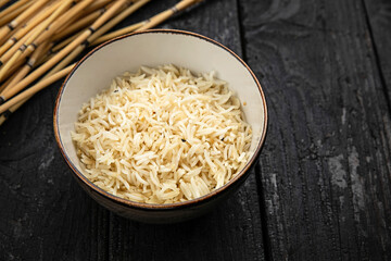 rice porridge in a plate on a dark background
