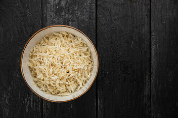 rice porridge in a plate on a dark background
