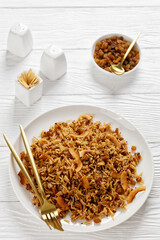 Coconut Rice with raisins on a plate, top view