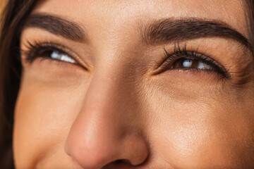 Close-up female face. Beautiful eyelashes and eyebrows. Concept of natural beauty, cosmetics, anti age treatment, wellness